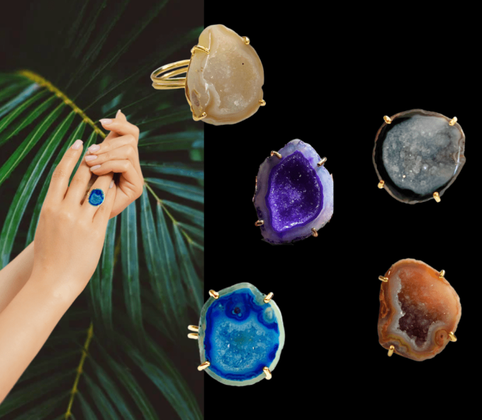 Hand wearing a blue druzy gemstone ring with palm leaves in the background.